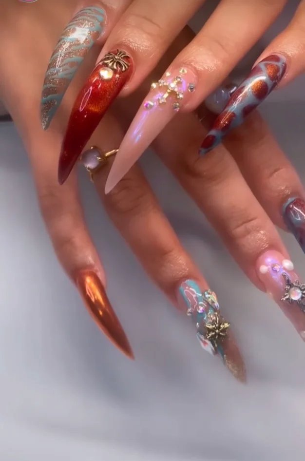 Client showing off a freshly finished custom nail set